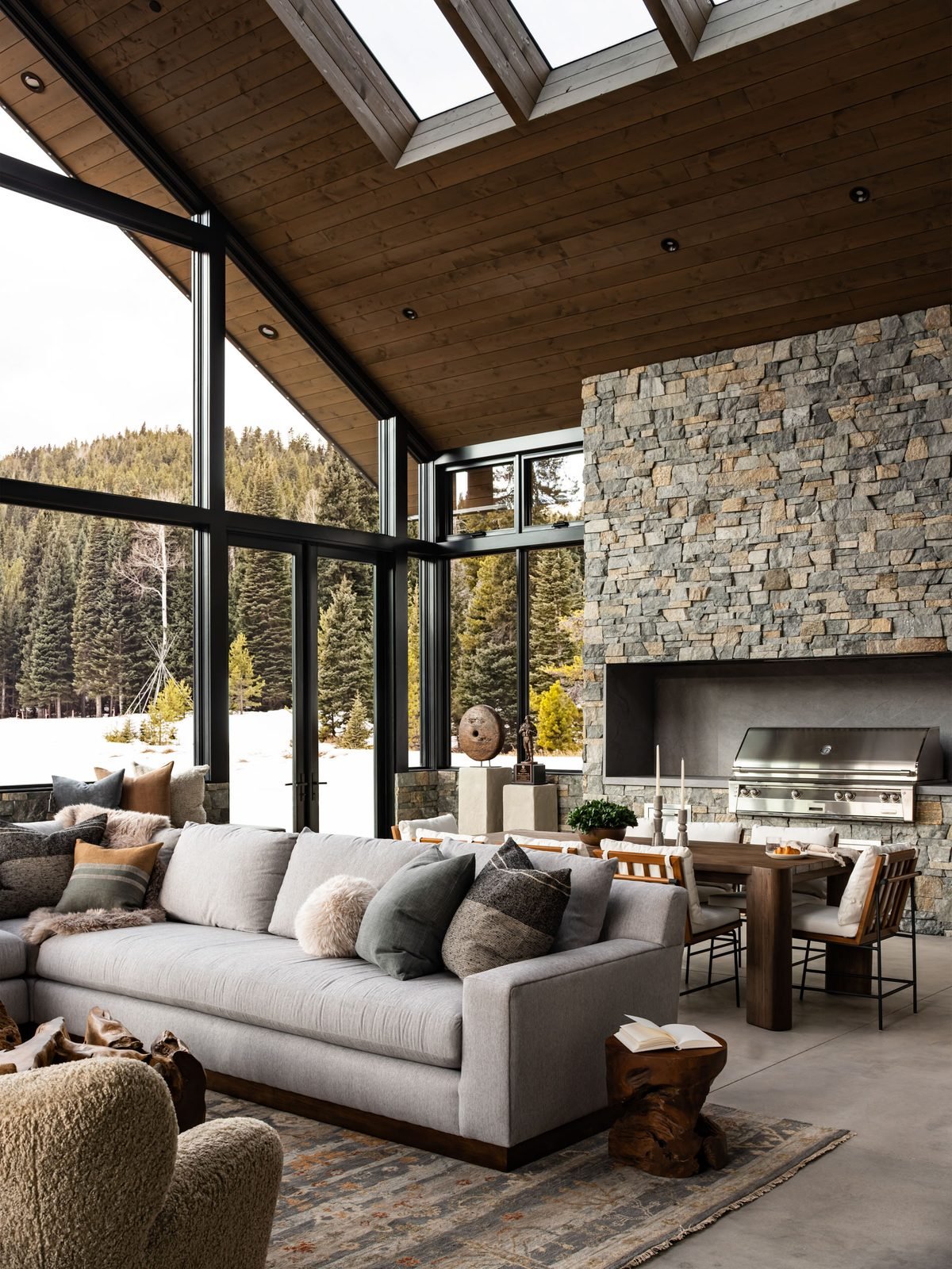 Vaulted great room with stone fireplace and skylights