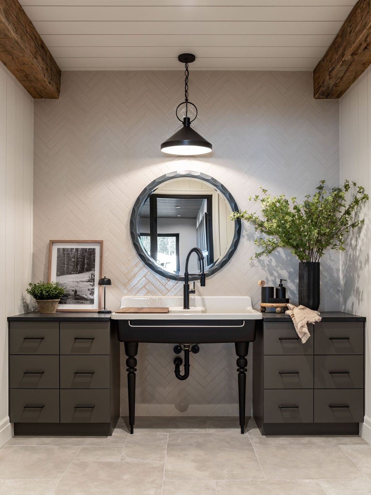 Mudroom utility sink with herringbone tile