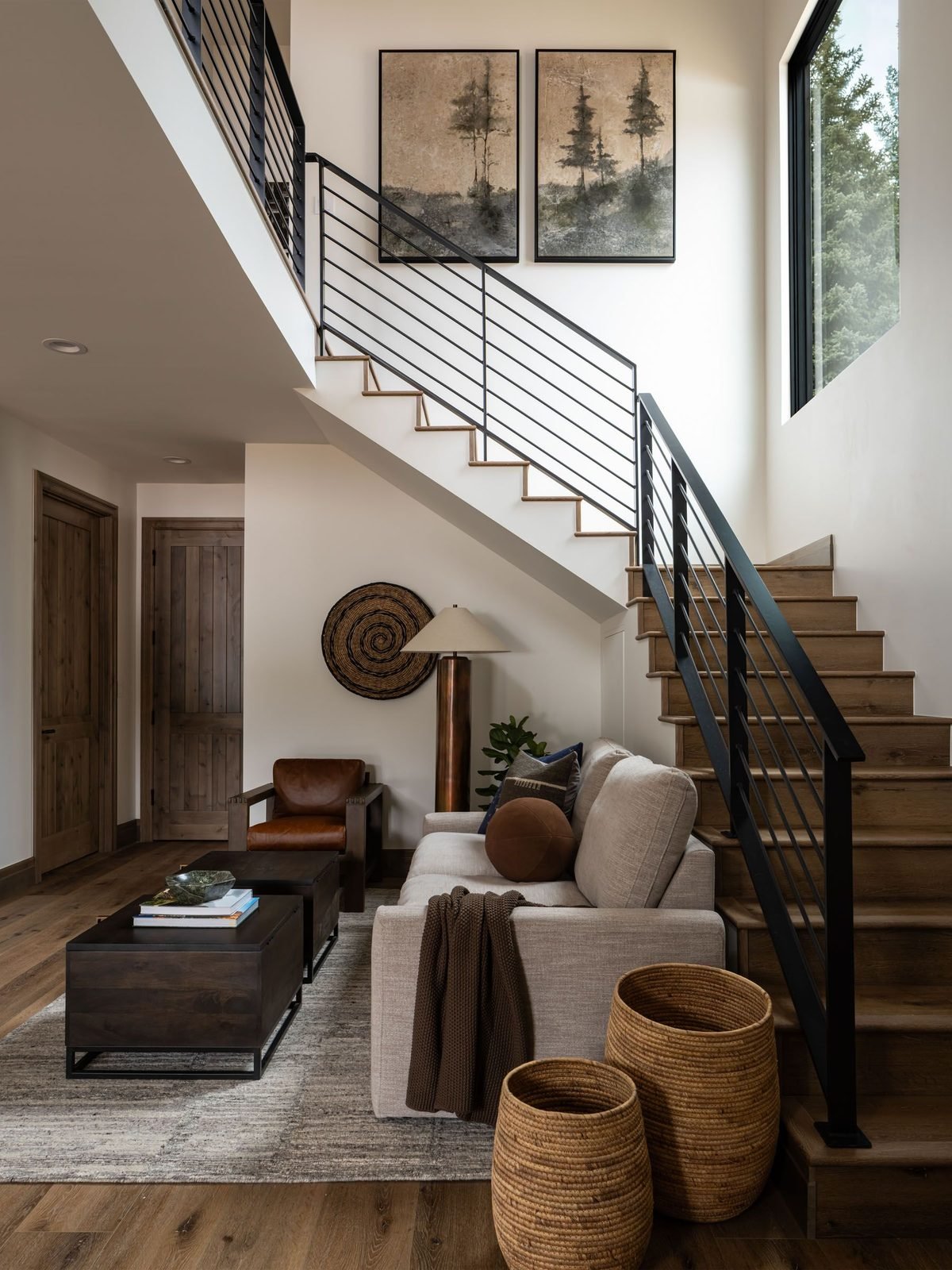 Open staircase with landscape artwork
