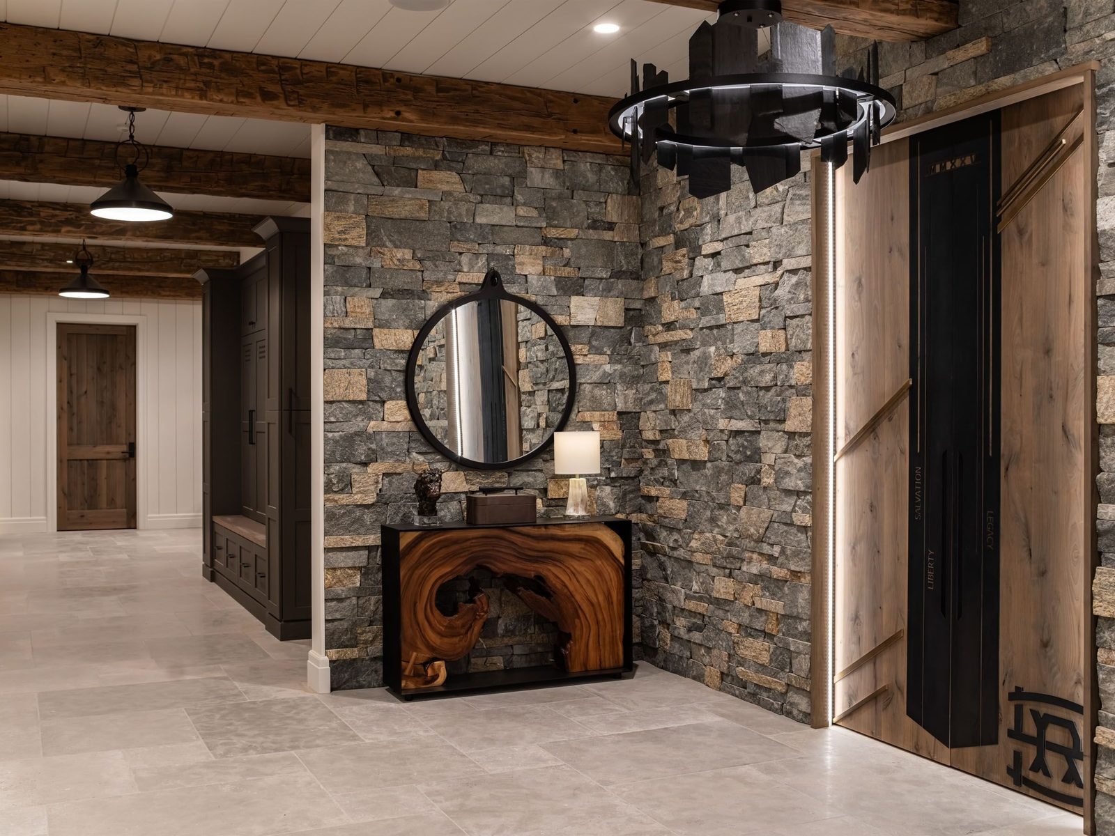 Stacked stone entry wall with wine room doors